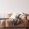 a couch with a table and a lamp
